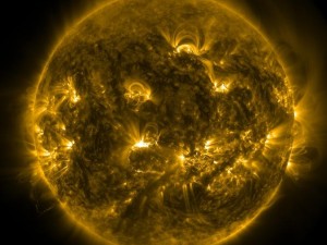 A mid-level solar flare erupted on the sun on 18 December 2014. It can be seen in this image from NASA's Solar Dynamics Observatory (SDO) as the bright spot near the center of the sun. SDO observes light in extreme ultraviolet wavelengths that can highlight the intense heat present in a solar flare. Credit: NASA/SDO