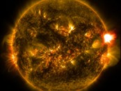 An medium-size solar flare erupts from the right side of the sun in this image in the early morning of 13 January, 2015 (British time). The image was recorded using two wavelengths (171 and 304 angstroms) of light too energetic for our eyes to see, as captured by NASA's Solar Dynamics Observatory. Credit: NASA/Solar Dynamics Observatory