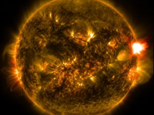 An medium-size solar flare erupts from the right side of the sun in this image in the early morning of 13 January, 2015 (British time). The image was recorded using two wavelengths (171 and 304 angstroms) of light too energetic for our eyes to see, as captured by NASA's Solar Dynamics Observatory. Credit: NASA/Solar Dynamics Observatory